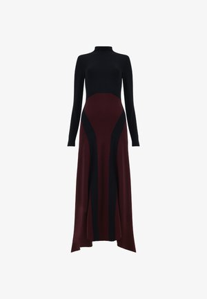 Long dress featuring a black top with a mock neck and a deep burgundy skirt. Smooth texture with black side panels and an asymmetrical hemline.