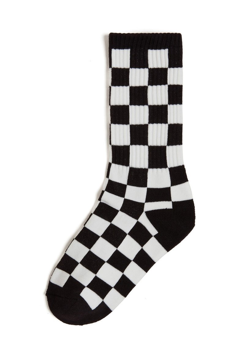 Calzino a scacchi bianco e nero, con texture a costine, lunghezza fino al polpaccio e realizzato in morbido materiale a maglia. Design a scacchiera notevole.