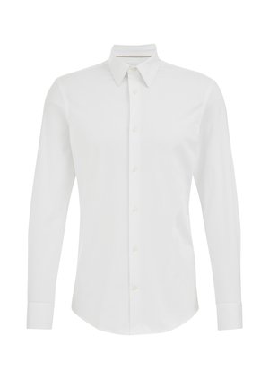 Biała koszula z długim rękawem wykonana z gładkiej tkaniny. Posiada kołnierzyk w szpic, zapięcie na guziki z przodu oraz zapinane na guziki mankiety. Klasyczny krój i neutralny kolor.