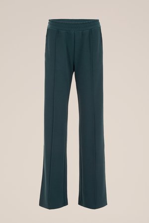 Tumši tirkīzzila, plaša diegu bikses ar elastīgu vidukli un smalkām krokām. Izgatavotas no gludas auduma ar maigu tekstūru.