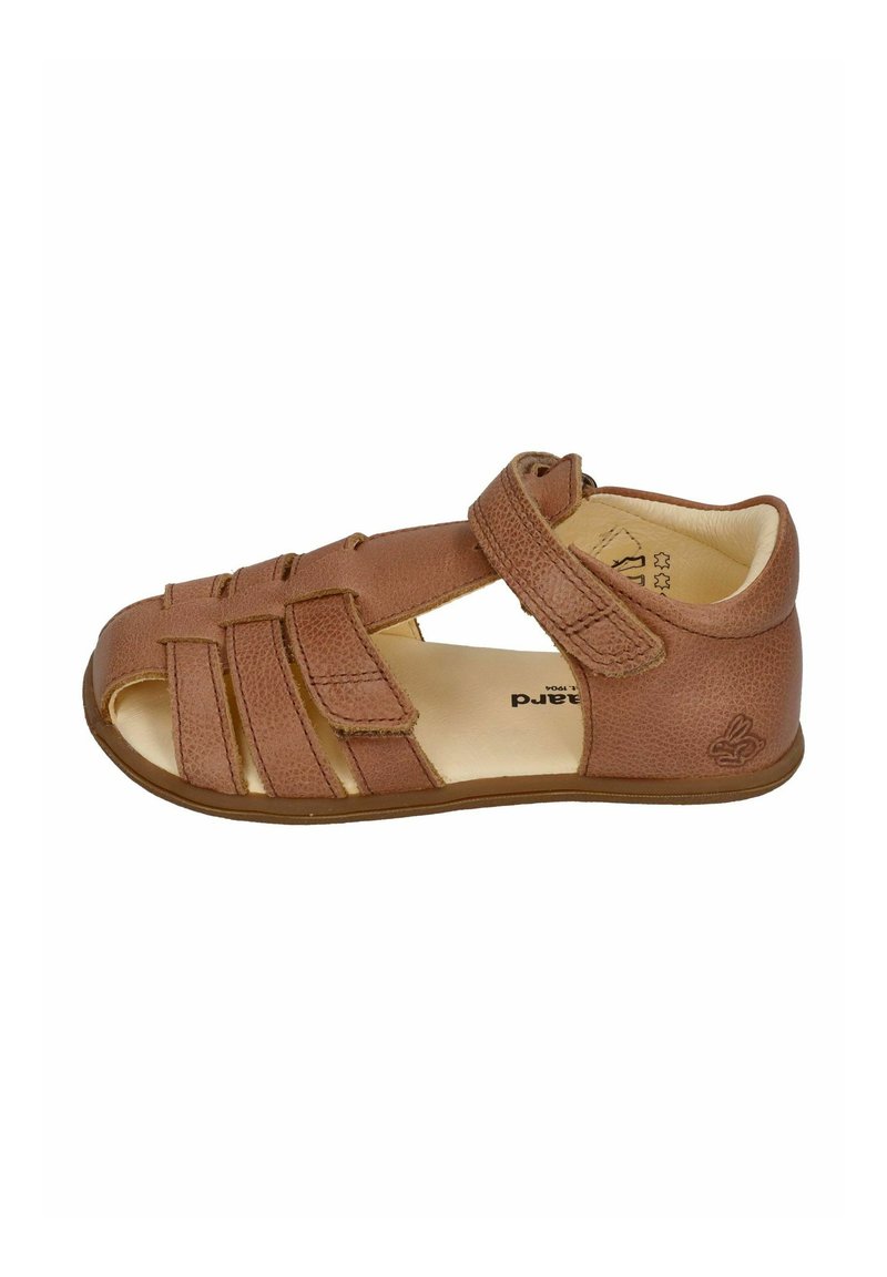 Brown leather sandal featuring an open design, strap closure, and textured surface, with raised accents on the sole and upper.