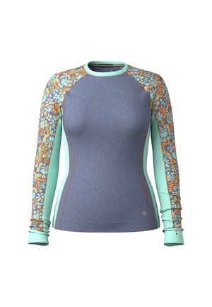 Haut à manches longues bleu avec des panneaux de manches à motifs floraux orange et bleu-vert. Présente un design ajusté et une texture douce.