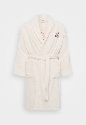 Hvit frotté badekåpe med knytbelte, korte ermer, to frontlommer og broderte detaljer på brystet. Myk, teksturert stoff.