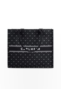 Black tote bag featuring a repeating monogram pattern. Rectangular shape with dual black handles and a white logo stripe labeled "CARLHEIM."