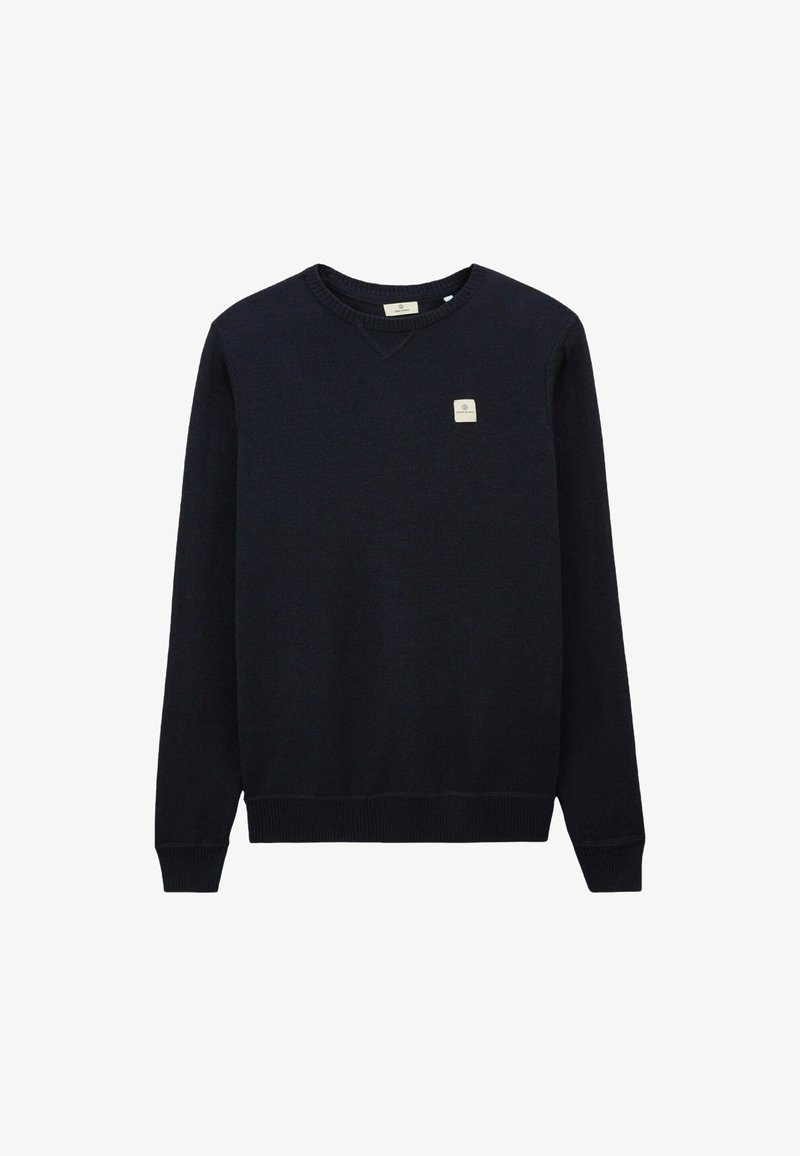 Pull marin avec col en V, bords-côtes aux poignets et à l'ourlet, présentant un petit patch logo sur la poitrine gauche. Texture tricot lisse, design décontracté.