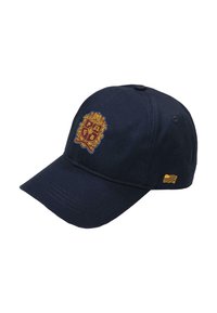 Marineblauwe baseballcap van katoen, met een gouden geborduurd schildlogo en een kleine gouden golfaccent aan de zijkant.