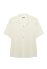 Camisa de manga corta con cuello en color crema, fabricada en una tela suave. Presenta un cierre frontal con botones y cinco botones, y un corte relajado.