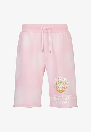 Pink cotton shorts with elastic waistband, drawstring, and printed lion graphic. Features splatter pattern and exposed stitching at hem.