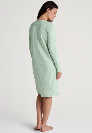 Nightgown a maniche lunghe di colore verde menta con motivo geometrico, caratterizzato da un collo rotondo e un tessuto morbido e leggero.