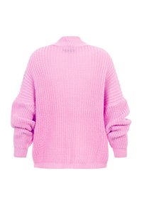 Ilgas rankovėmis stambiai megztas megztinis šviesiai rožinės spalvos su laisvu kirpimu ir briaunuotomis rankogaliais, parodytas nugaros pusėje ant baltos spalvos fono.