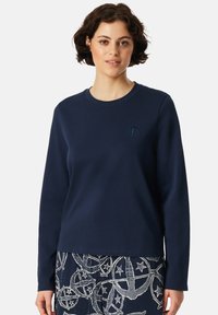 Marinblå sweatshirt med långa ärmar och rund halsringning. Har diskret logotypbroderi på bröstet. Slät, mjuk tygkvalitet.