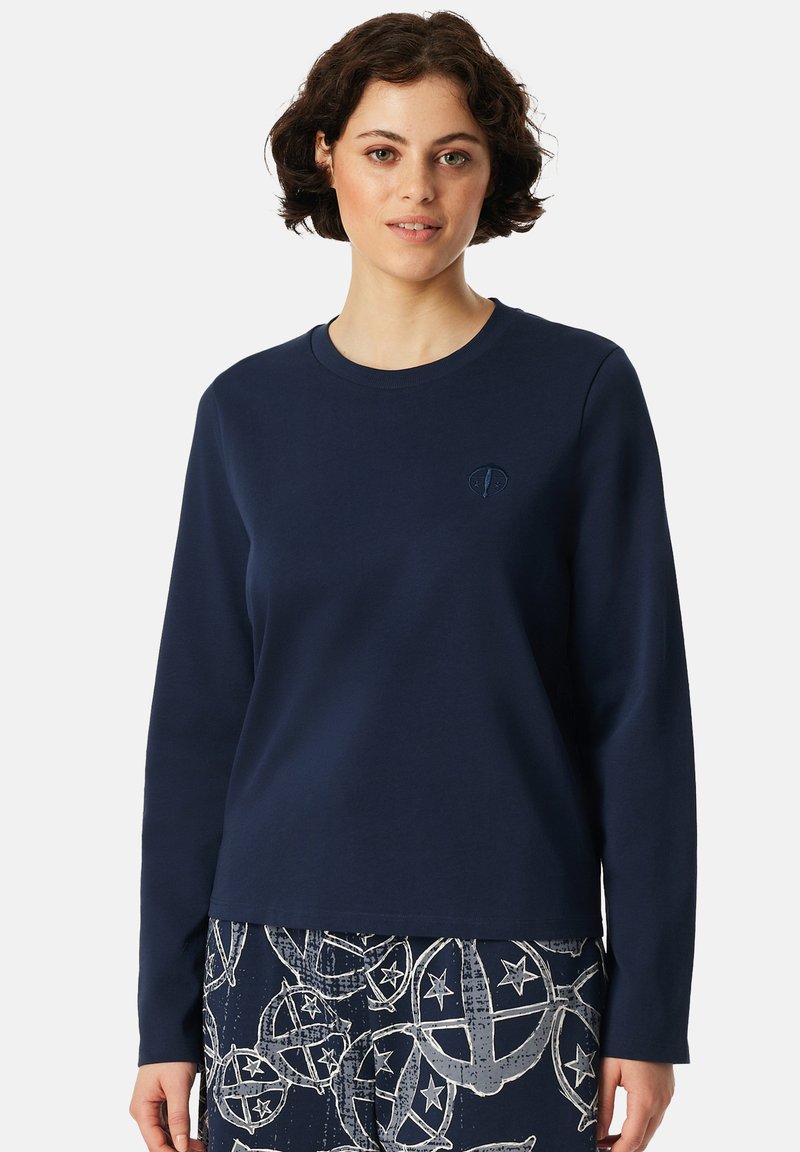 Marinblå sweatshirt med långa ärmar och rund halsringning. Har diskret logotypbroderi på bröstet. Slät, mjuk tygkvalitet.