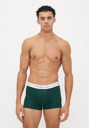 Zöld pamut boxer alsónadrág fehér derékkal, amelyen a "TOMMY HILFIGER" logó látható. Az alsónadrág testhez simuló szabású és sima tapintású.