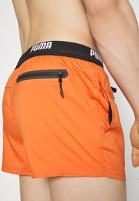 Puma SWIM MEN LOGO - Badeshorts - chili powder