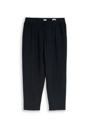 Schwarze Hose mit lockerer Passform, elastischem Bund und Kordelzug, zulaufende Beine, vordere Falten, flach auf weißem Hintergrund liegend.