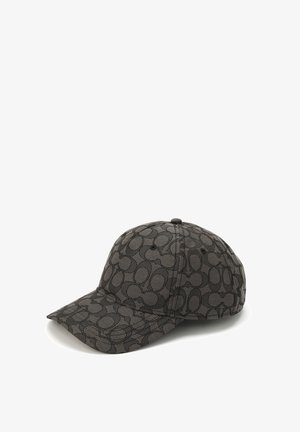 Baseball cap in black fabric, featuring a textured pattern of overlapping circles. Curved brim and structured design with ventilation holes.