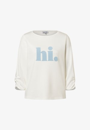 White long-sleeve shirt with ruched sleeves and light blue textured "hi." text centered on the front.