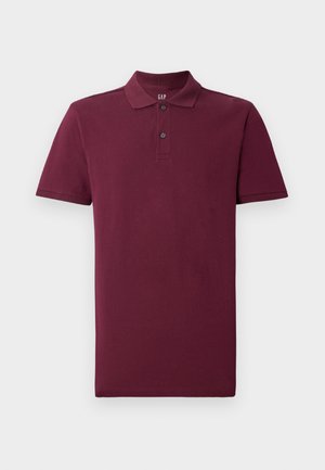 Polo de manga corta burdeos hecho de algodón, con un collar clásico, tapeta de dos botones y puños de canalé. Textura suave.