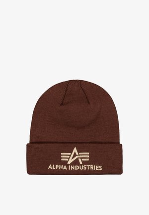 Brown knitted beanie hat with folded cuff featuring Alpha Industries logo and text embroidered in beige on the front.