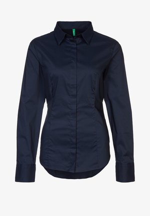 Navy blue button-up shirt made of cotton blend; features a collar, long sleeves, and a fitted design with front seam detail.