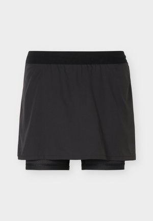 Jupe de sport noire avec short de compression intégré, taille élastique, tissu lisse, conçue pour le sport ou les activités physiques.
