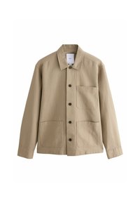 Beige Jacke mit strukturierter Oberfläche, Knopfleiste und klassischem Kragen. Sie verfügt über zwei große Fronttaschen und eine einzelne Brusttasche.