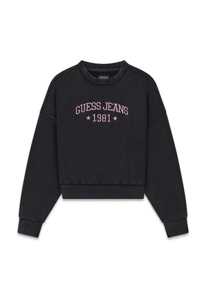 Musta lyhyt puuvillainen collegepaita, jossa on resoriset hihansuut ja helma. Varustettu vaaleanpunaisella kirjailulla, jossa lukee "GUESS JEANS 1981" ja kaksi tähteä.