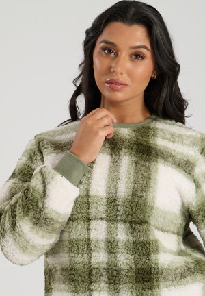 Grøn og hvid rutet fleece-pullover, tekstureret, med rund halsudskæring og ribbede manchetter, lavet af et blødt, flosset materiale.
