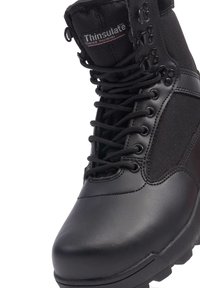 Black insulated boot featuring a mix of smooth leather and textured fabric, with a high ankle design, metal eyelets, and thick laces.
