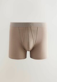 Beige boxershorts met een gladde textuur, voorzien van een geribbelde tailleband met de opdruk "NEXT" en een aansluitende pasvorm.