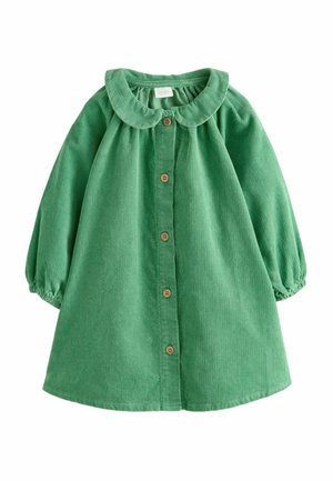 Robe bébé en velours côtelé vert avec manches longues bouffantes, col arrondi et fermeture à boutons en bois sur le devant.