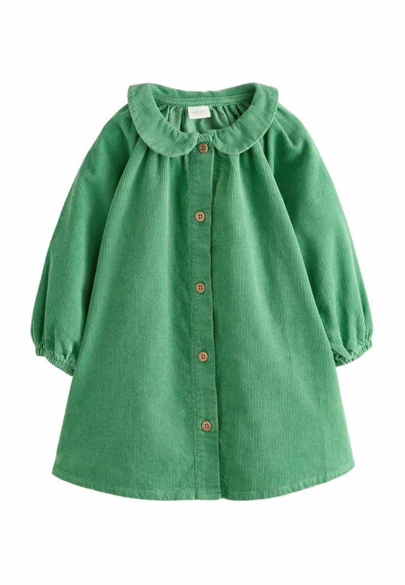 Robe bébé en velours côtelé vert avec manches longues bouffantes, col arrondi et fermeture à boutons en bois sur le devant.