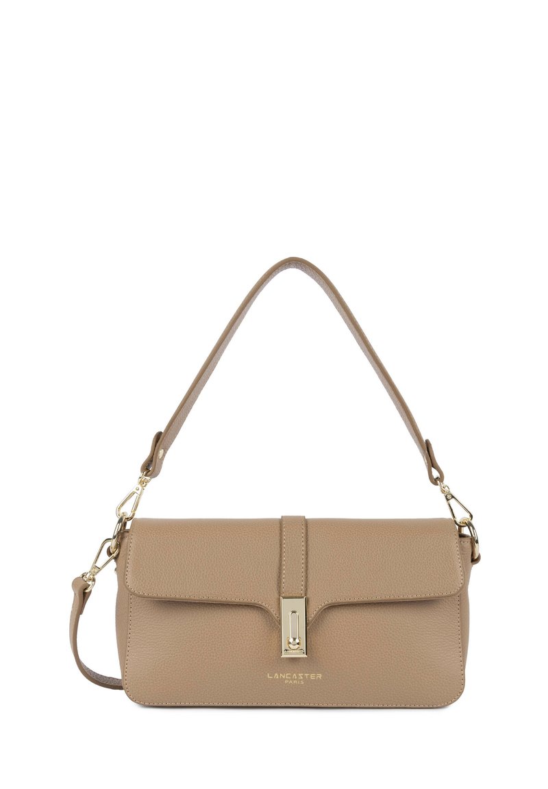 Beige textured leather handbag with a flap closure, adjustable shoulder strap, and gold-tone hardware. Features embossed brand logo.