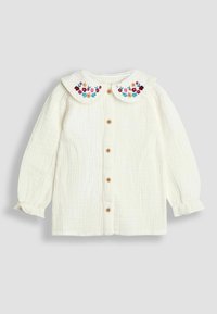Weiße strukturierte langärmelige Babybluse mit Holzknöpfen und einem runden Kragen, bestickt mit roten, rosa, gelben Blumen und grünen Blättern.