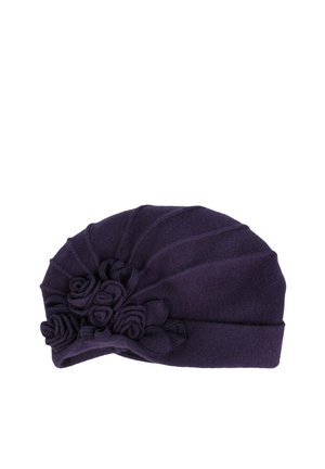 Dark purple woolen beret with gathered folds and decorative fabric roses on one side.