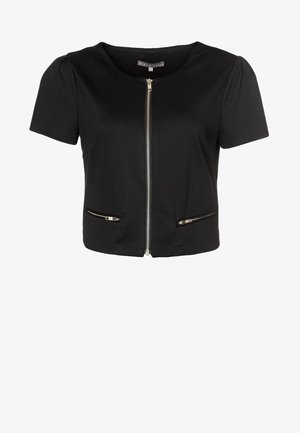 Černý krátký rukáv top s kulatým výstřihem, uzavíráním na přední zip a dvěma kapsami na zip, vyrobený z hladké tkaniny s mírnou texturou.