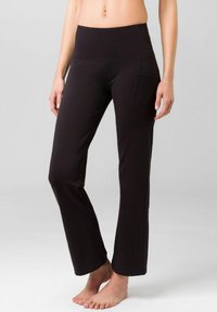 Black flared yoga pants with a wide waistband and side pocket, made from soft, stretchy fabric, smooth texture, and fitted design.