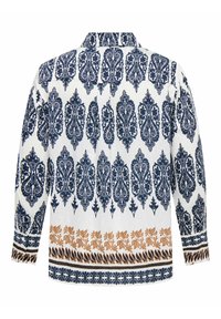 Bela dolga srajca z modrimi in rjavimi zapletenimi cvetličnimi in paisley vzorci, s podvihanim ovratnikom in vzorčastimi manšetami.