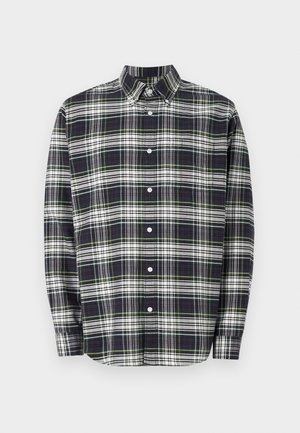 Srajca s dolgimi rokavi v karirastem vzorcu v mornarsko modri, zeleni in beli barvi. Ima ovratnik s gumbi, sprednje gumbe in sproščen kroj. Bombažna tkanina.