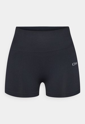 Schwarze, anliegende Shorts aus elastischem Material mit einem breiten Bund und subtilen Logodetails an der Seite. Glatte Oberflächenstruktur.