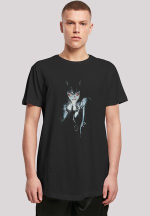 Black cotton T-shirt featuring a graphic print of a character with cat ears, white gloves, and red glasses, set against a dark background.