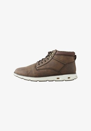 Bottines en cuir marron avec un bout rond, laçage à l'avant, œillets en métal et semelle de confort blanche. Comprend un col rembourré pour plus de confort.