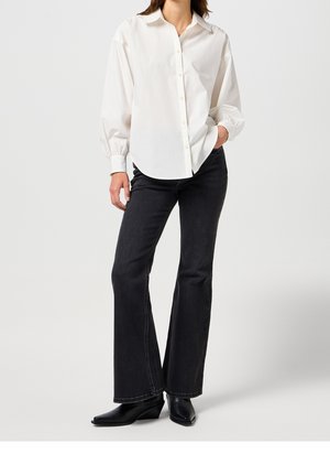 Flared Jeans - black denim