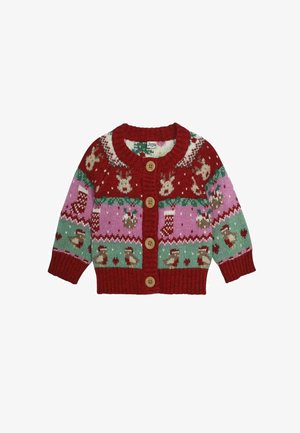 Raudona megzta kardiganas su žaliais, rožiniais ir baltais šventiniais raštais. Pavaizduoti šiaurės elniai, kojinės ir širdys. Keturi mediniai mygtukai priekyje.