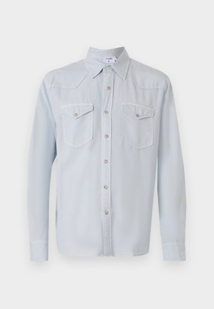 Világoskék, hosszú ujjú gombos ing gallérral. Két mellzseb, ezüst gombok és sima textúra jellemzi.