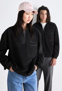 Tommy Jeans ZIP UNISEX - Suéter de forro polar - black