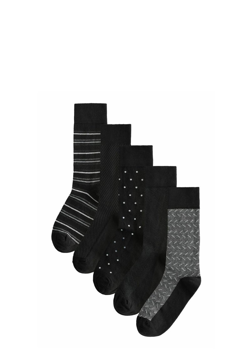 Cinq paires de chaussettes noires avec des designs variés : une avec des rayures, une avec des pois, une avec un motif en chevrons, et des couleurs unies.