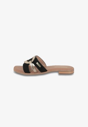 Sandale à glissière en suede noir avec des accents métalliques dorés, design à bout ouvert, semelle plate tan et détails brodés le long des bords.