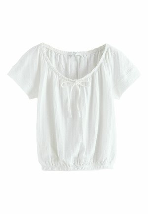 Blouse blanche à manches courtes avec ourlet élastique, encolure ronde, détail noué au centre et fines rayures verticales texturées.