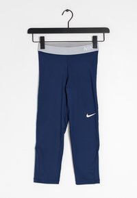 Marinblå träningsleggings med grå midja, med en vit Nike swoosh-logotyp på vänster lår. Tillverkade av ett stretchigt material.